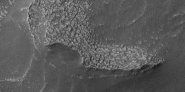 Close view of tongue-shaped glaciers, as seen by HiRISE under HiWish program. Polygons are visible.